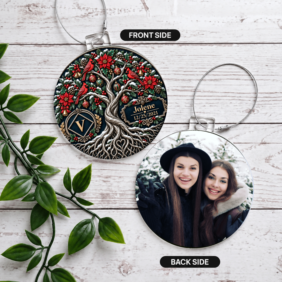 Two round acrylic ornaments, front and back views, silver cords on white wooden surface