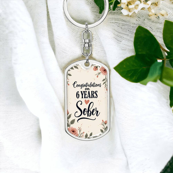 Silver dog tag keychain with floral Congrats on 6 years Sober lettering