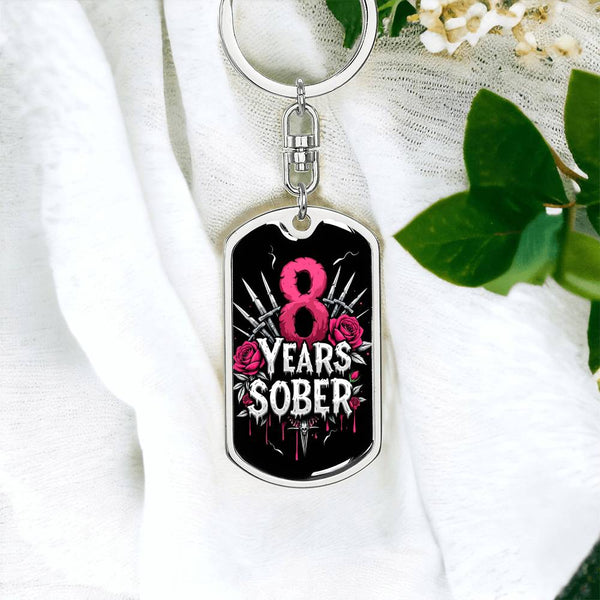 Silver dog tag keychain with 8 Years Sober graphic on front, hanging on ring