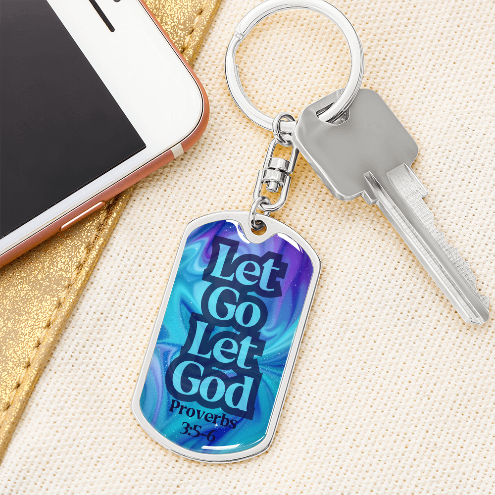 Silver dog tag keychain with blue front reading “Let Go Let God” and keys attached