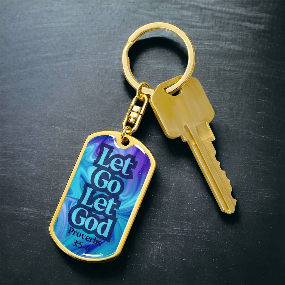 Gold dog tag keychain with swivel ring and key, blue tag reading “Let Go Let God”