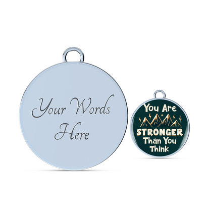 Silver bangle bracelet with large “Your Words Here” round charm and small teal charm