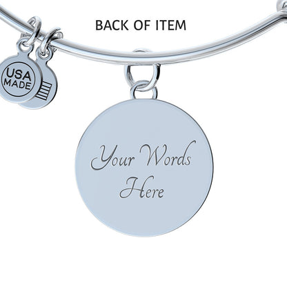 Silver bangle bracelet with “Your Words Here” round charm and “USA MADE” tag