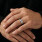 Silver engraved date ring on hand, close view of band lettering