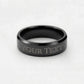 Engraved dark-tone band ring with “YOUR TEXT” lettering