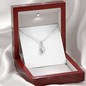 Necklace with CZ teardrop pendant in open red jewelry box