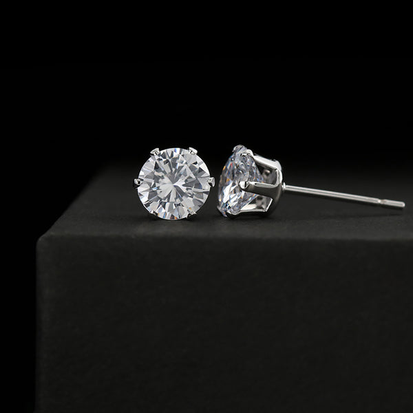 Round cubic zirconia stud earrings in silver-tone settings with clear stones