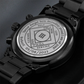 Men's black wrist watch with engraved caseback and linked steel bracelet