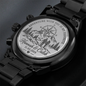 Close-up of engraved watch case back with adventure scene and date
