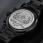 Engraved round case-back on black chronograph watch with metal link band