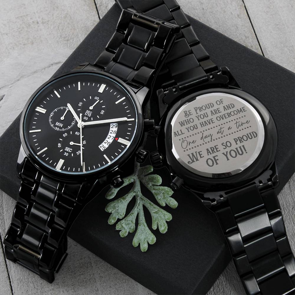 Black chronograph wristwatch with metal link band and round engraved keepsake