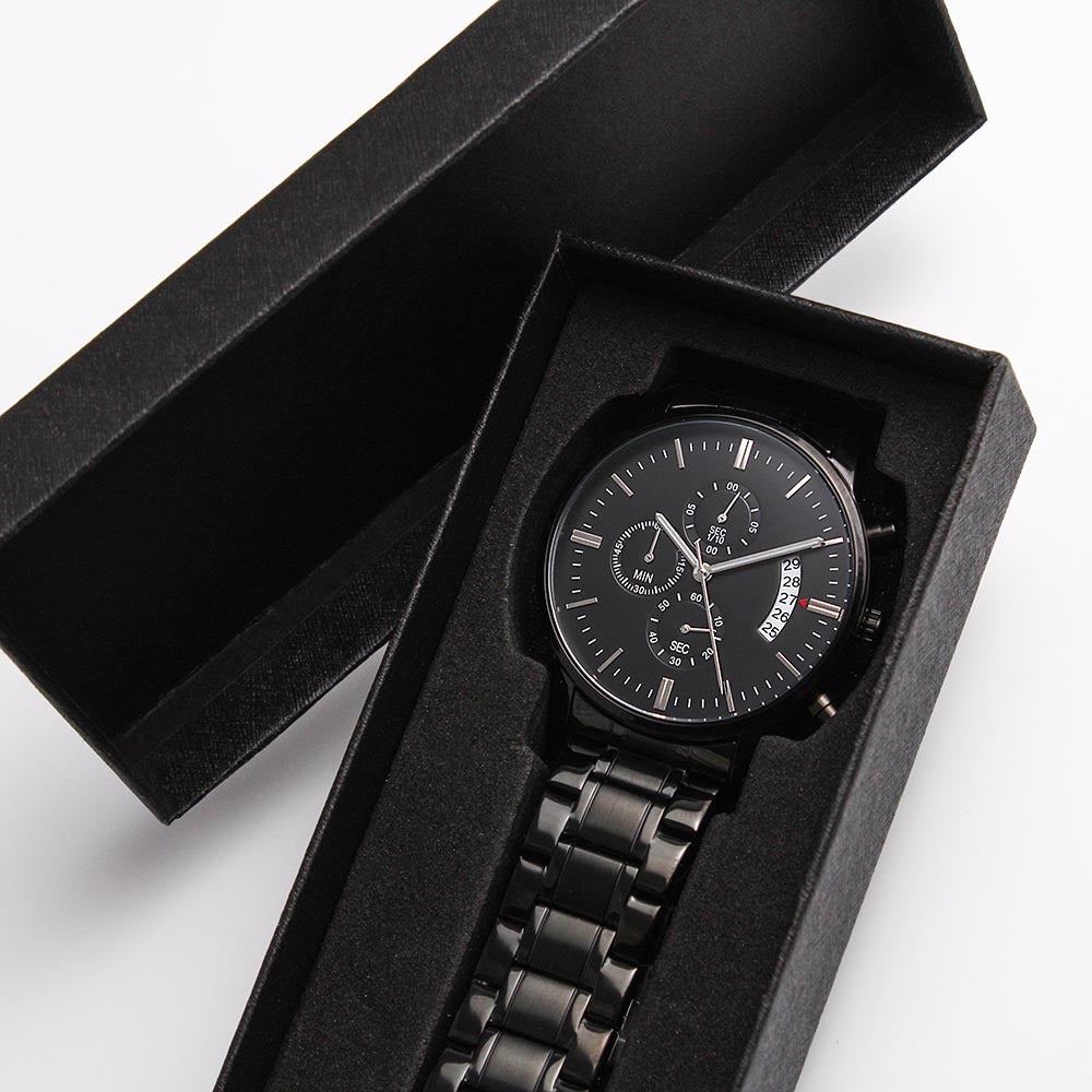 Black wristwatch in open black gift box with foam insert and metal link band
