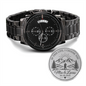 Black chronograph watch with stainless bracelet and three subdials