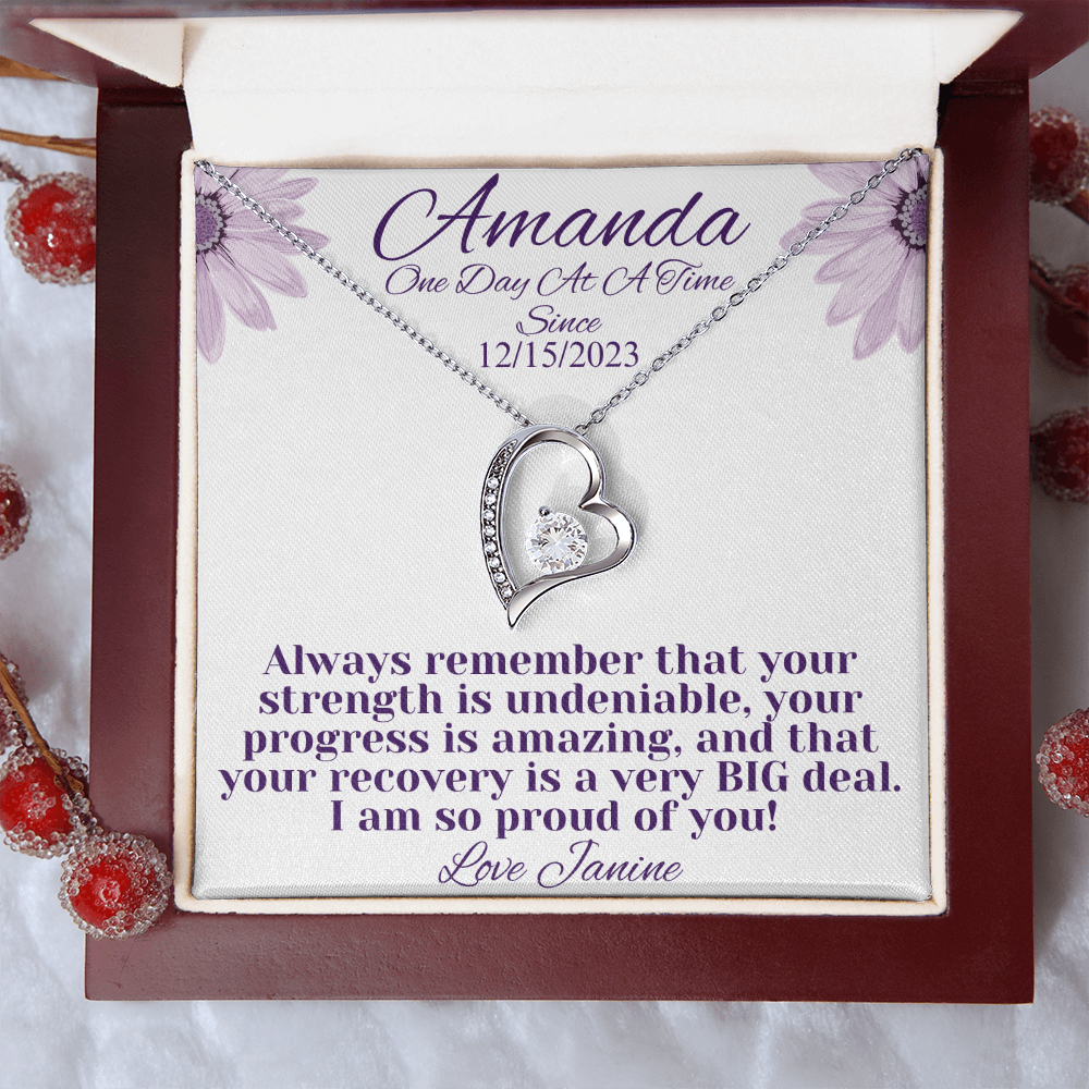 Silver heart recovery necklace with crystal-studded pendant in red gift box