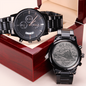 Black chronograph wristwatch with matching engraved case-back coin in gift box