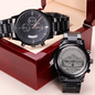 Black metal wristwatch showing dial and engraved caseback in red box