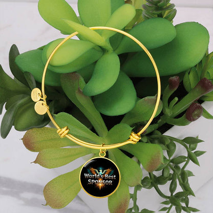 Gold bangle bracelet with round “World’s Best Sponsor” charm and two disc tags