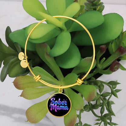 Gold bangle bracelet with “Sober Mama” round charm pendant