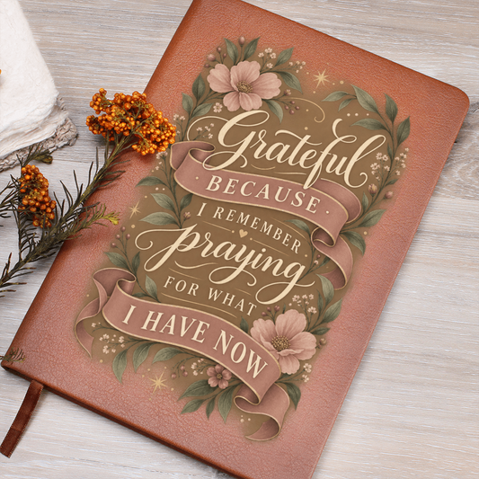 Recovery journal with orange vegan leather cover and floral “Grateful” text design.