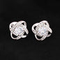 Cubic zirconia stud earrings with round halo swirl setting