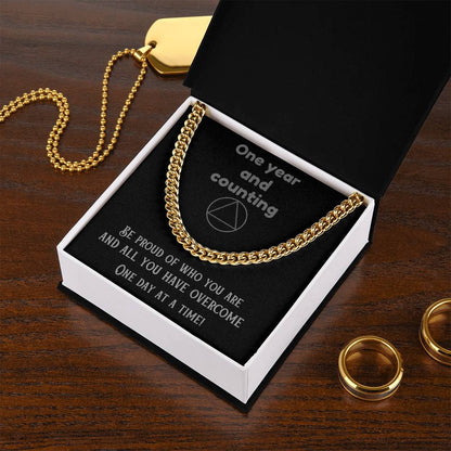 Gold-tone chain necklace shown in an open gift box