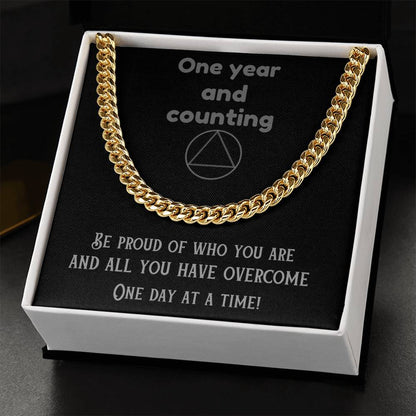 Gold-tone curb-link chain necklace on a black insert