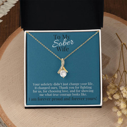 Gold-tone teardrop pendant necklace in gift box with blue card backing