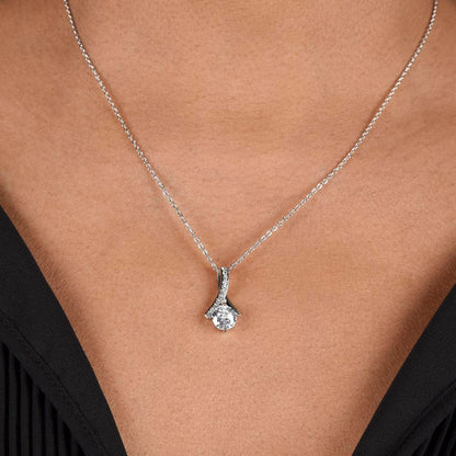Silver teardrop crystal pendant necklace on a neckline chain