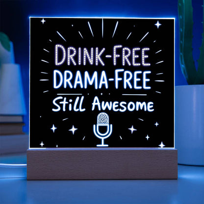 Glowing LED quote plaque with blue-lit border and “DRINK-FREE DRAMA-FREE” mic icon