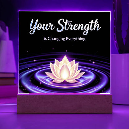 LED strength plaque with “Your Strength” and glowing lotus in purple ring, on wood base