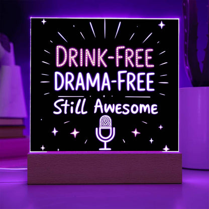 Glowing LED quote plaque with purple text “DRINK-FREE DRAMA-FREE” and microphone icon