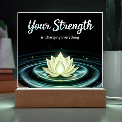 LED strength plaque with “Your Strength” and glowing lotus in teal ring, on wood base