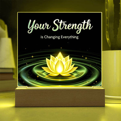 LED strength plaque with “Your Strength” and glowing lotus in yellow-green ring, on wood base