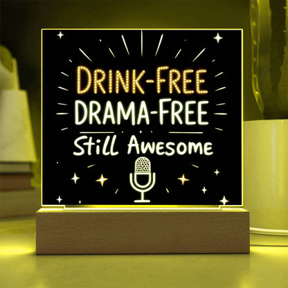 Glowing LED quote plaque with warm yellow text “DRINK-FREE DRAMA-FREE” and mic icon