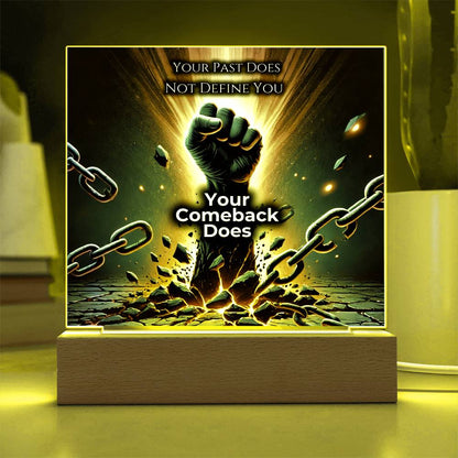 LED plaque with warm yellow glow border, fist and chains graphic on wood base