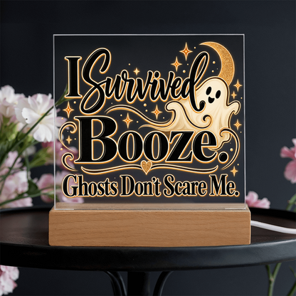 LED-lit acrylic Halloween plaque on wood base, ghost and “I Survived Booze” text glowing gold