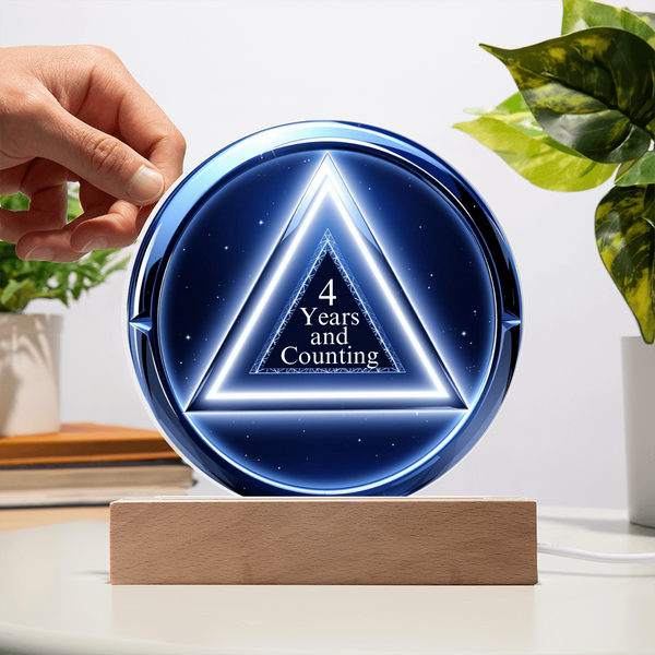 LED circle plaque with “4 Years and Counting” on wood base, blue glow