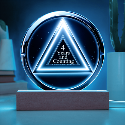 LED circle plaque with “4 Years and Counting” on wood base, blue glow