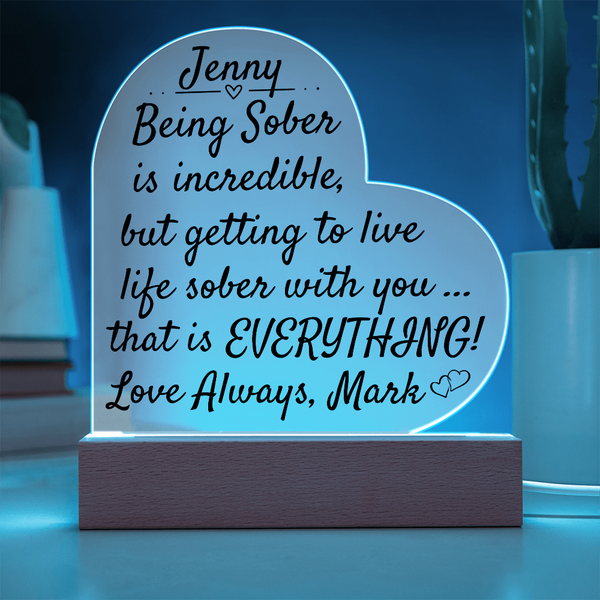 LED heart night light with blue glowing outline and light wood base