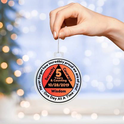 Round sobriety date ornament held by hand, 5 Years & Counting, 10/28/2019, Wisdom