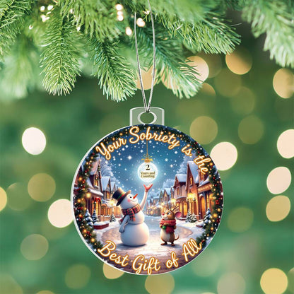 Hanging circular acrylic bulb ornament with snowman winter scene and 'Your Sobriety' text