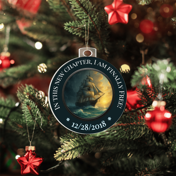 Round hanging ornament with ship artwork, ring text, and date 12/28/2018