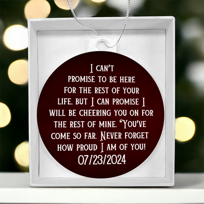 Maroon acrylic bulb ornament in white gift box with printed quote and date 07/23/2024