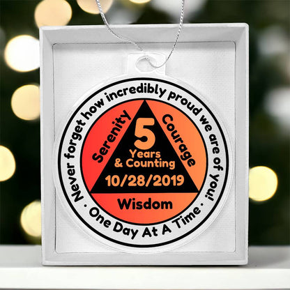 Round silver-tone sobriety date ornament with '5 Years & Counting' printed medallion and chain