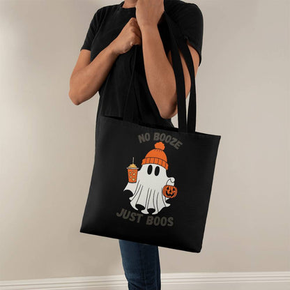 Black Halloween tote bag with ghost graphic, held by two handles