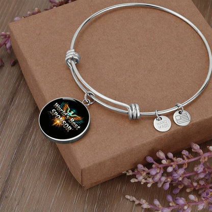 Silver bangle bracelet with round “World’s Best Sponsor” charm and small side tags