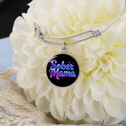 Silver bangle bracelet with round “Sober Mama” charm pendant
