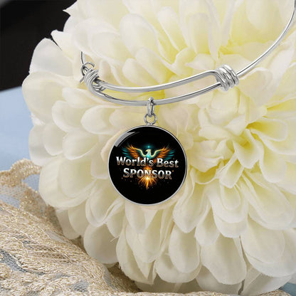 Silver bangle bracelet with round “World’s Best Sponsor” charm