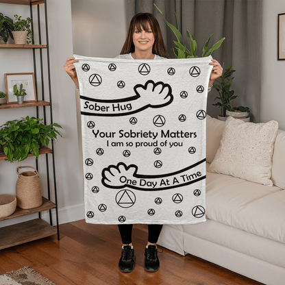 Slogan blanket, white with black 'Your Sobriety Matters' message and peace icons