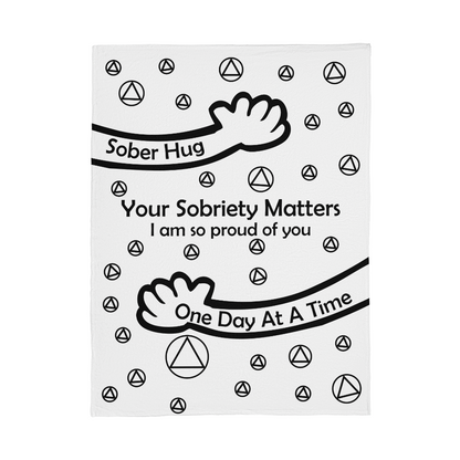 Slogan blanket, white with black 'Sober Hug' design and 'One Day At A Time' text